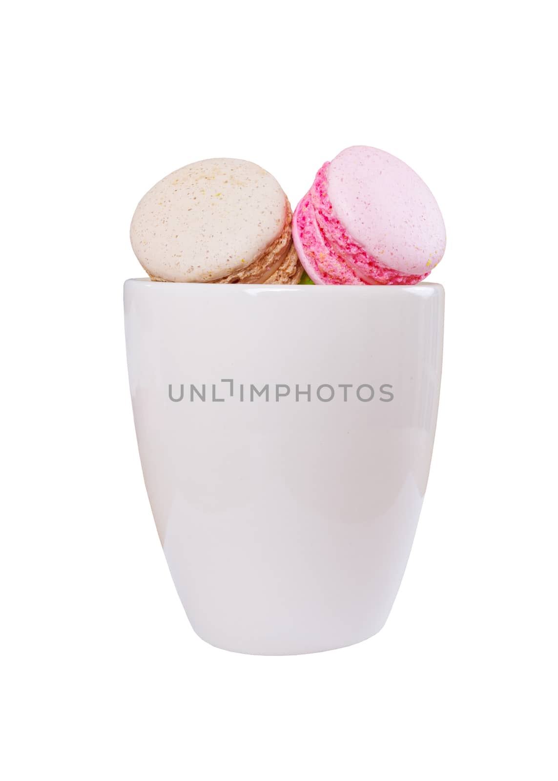traditional french colorful sweet Macaron in cup on white background