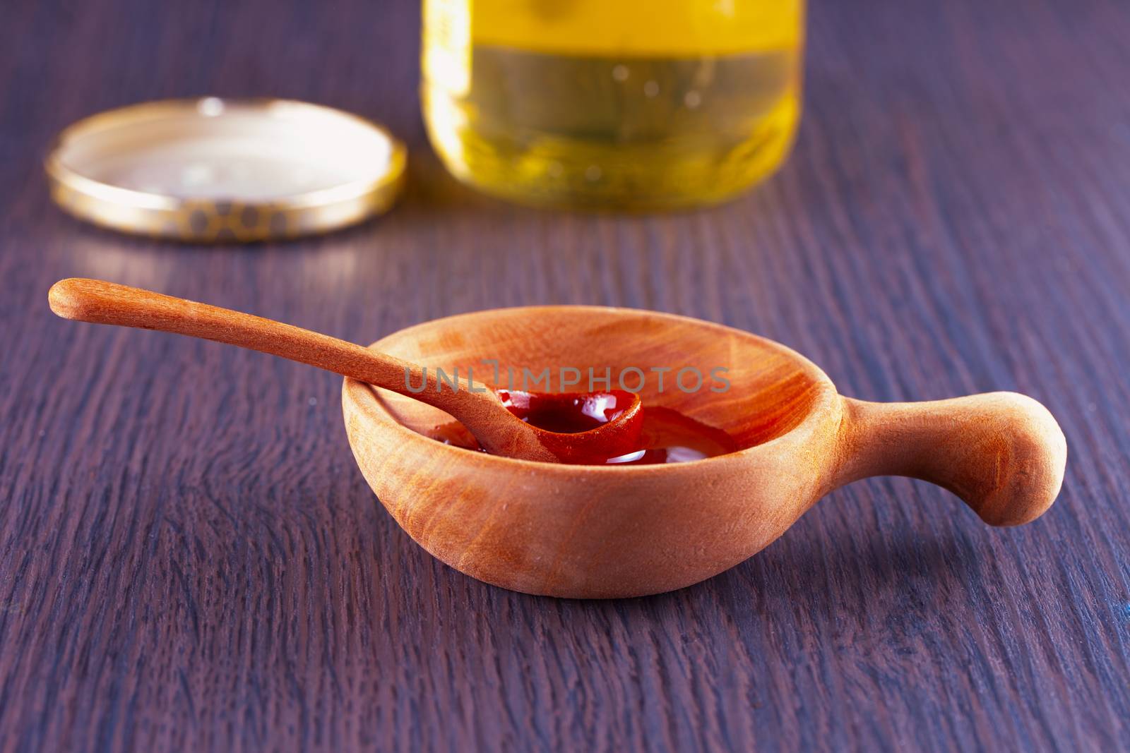 Honey in a wooden cup, with spoon