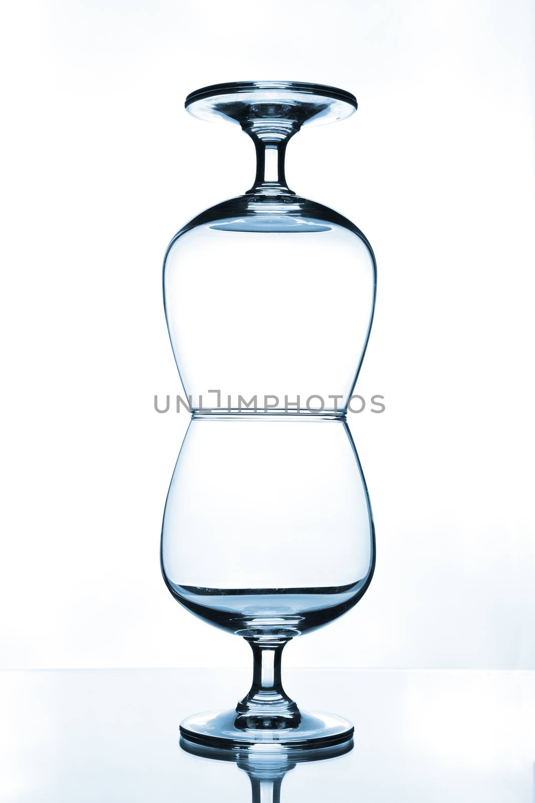 stack of empty wine glass on glass table 