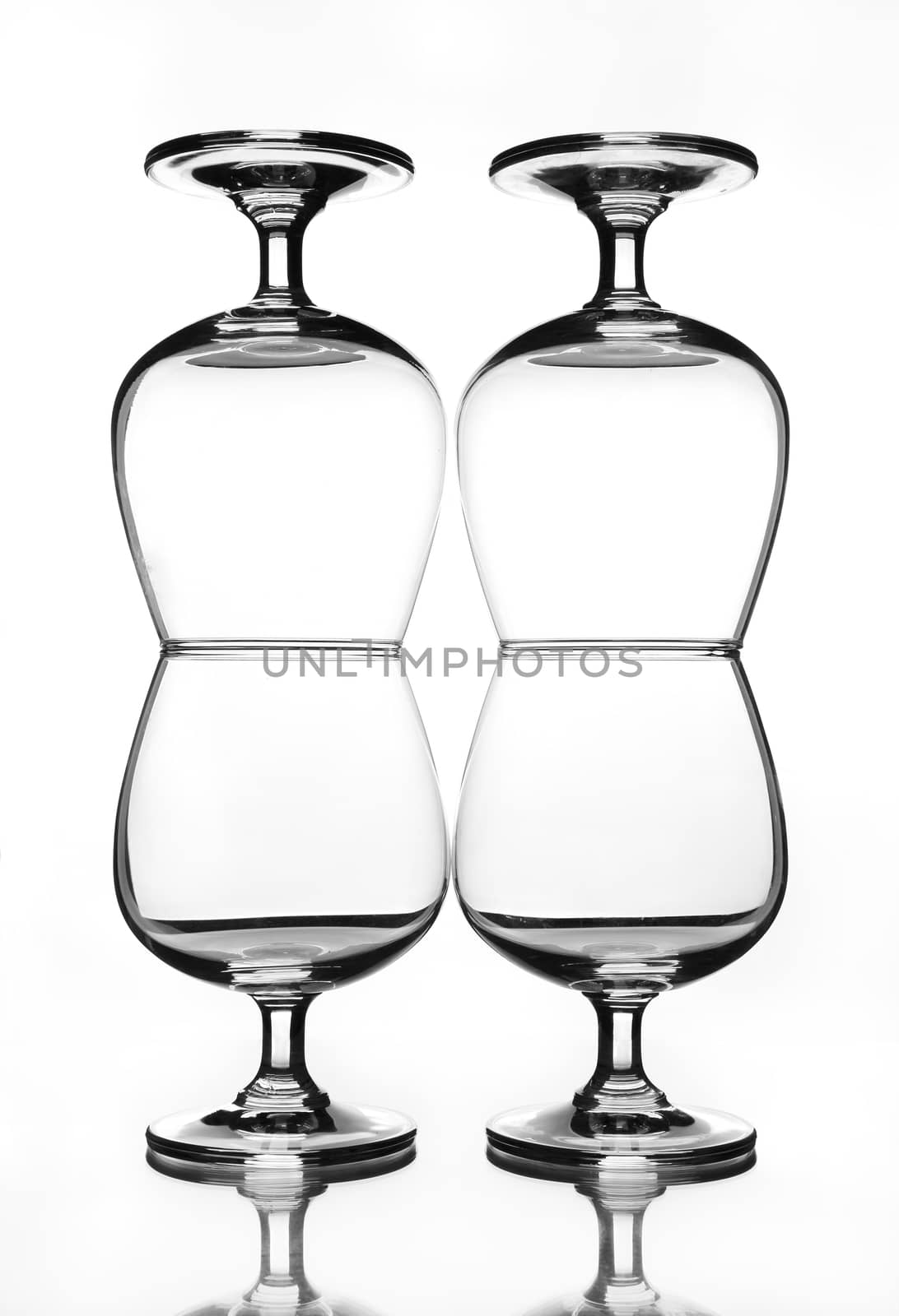 stack of empty wine glass with shadow (gray scale)
