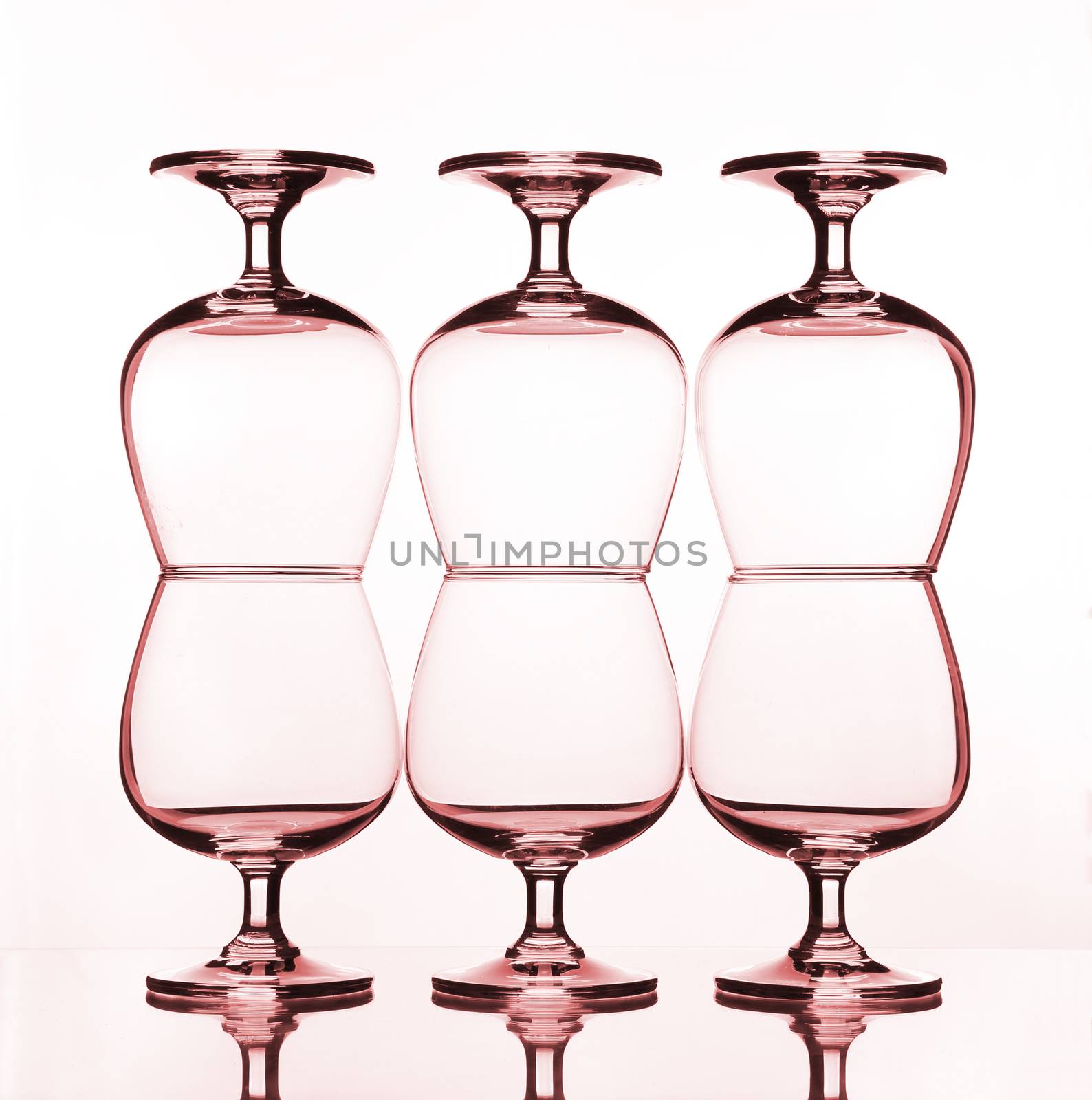 stack of empty wine glass on glass table 