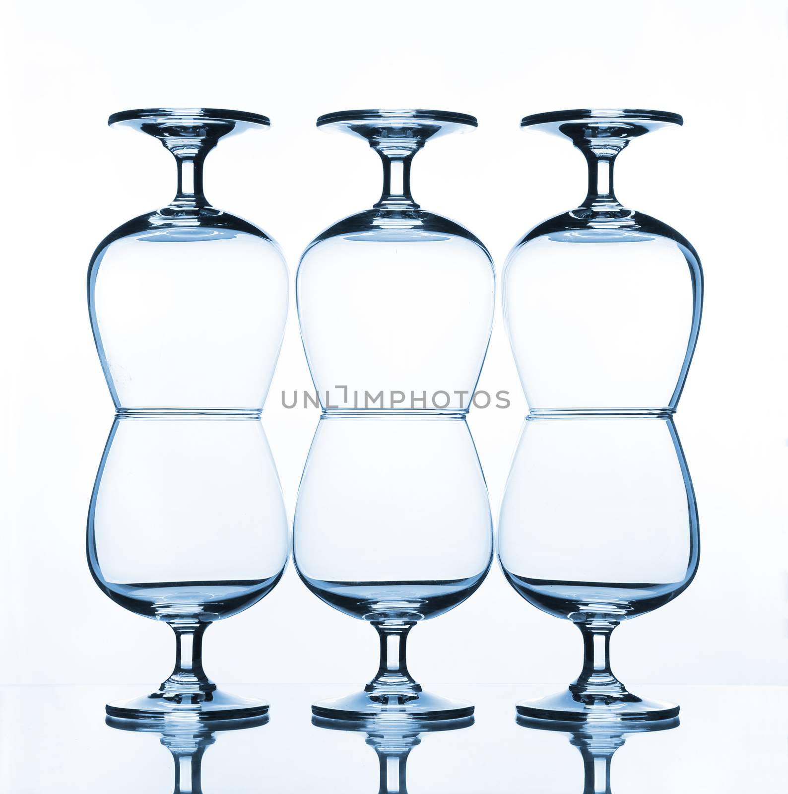 stack of empty wine glass on glass table 