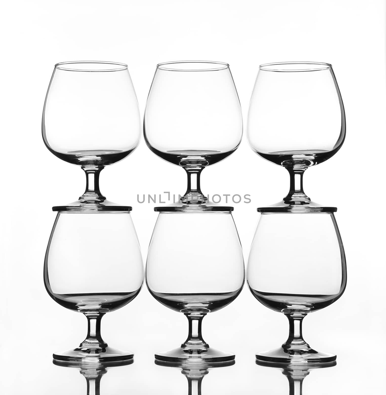 stack of empty wine glass with shadow (gray scale)