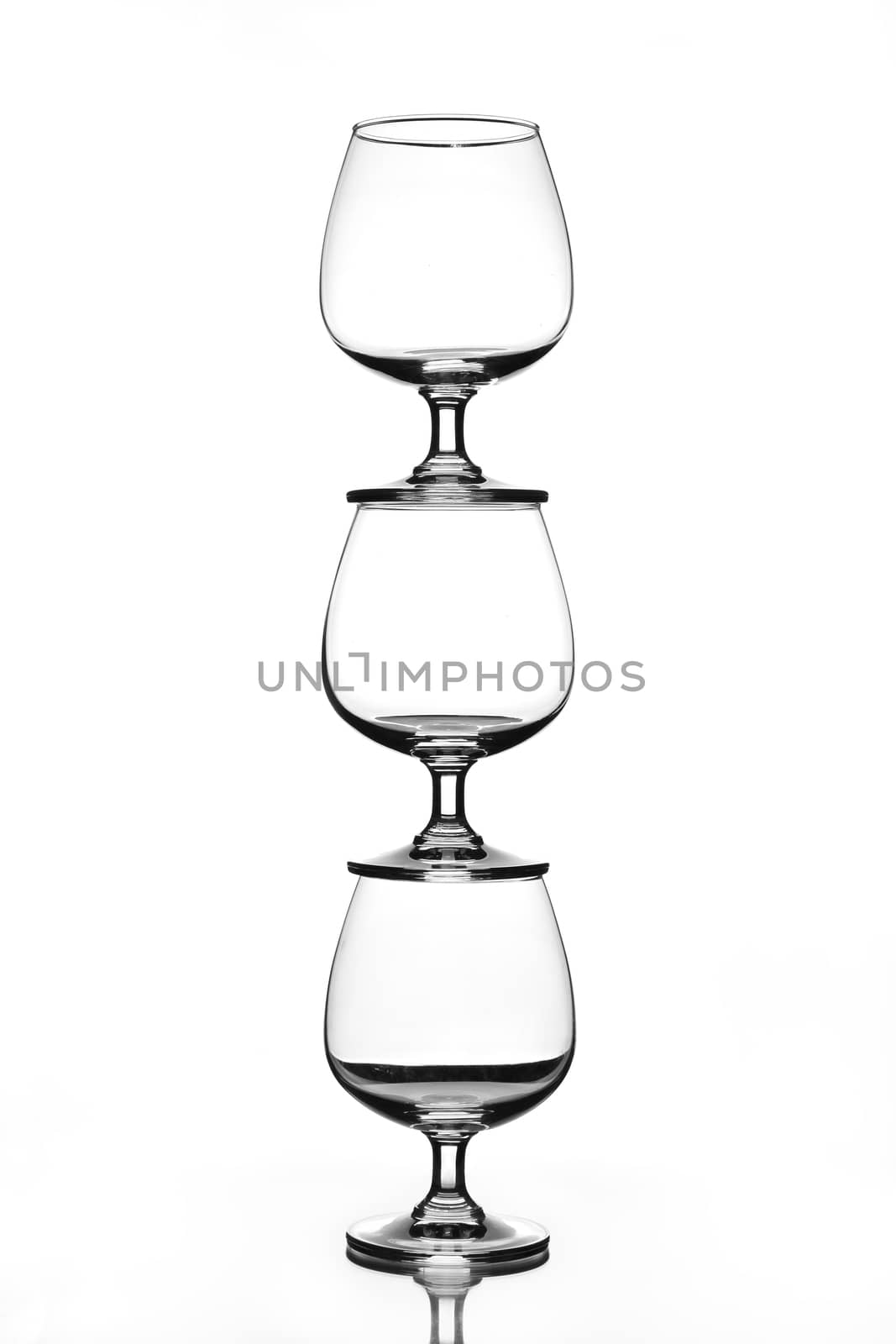 stack of empty wine glass with shadow (gray scale)