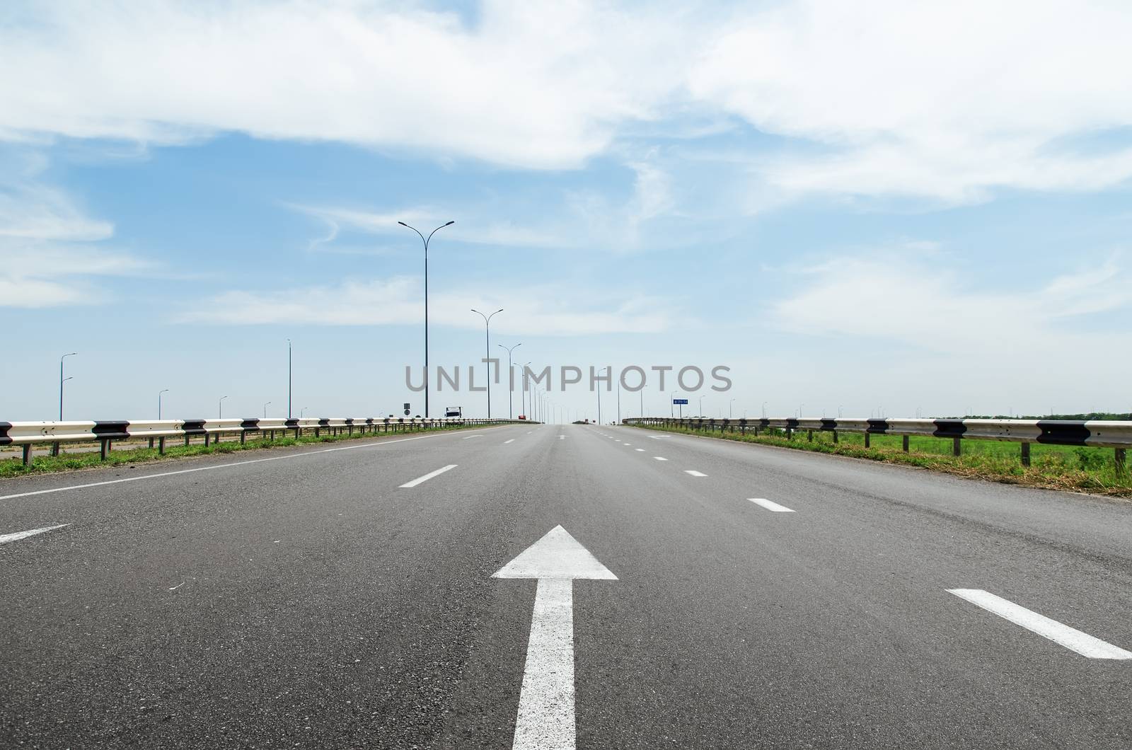 white arrow on asphalt road by mycola