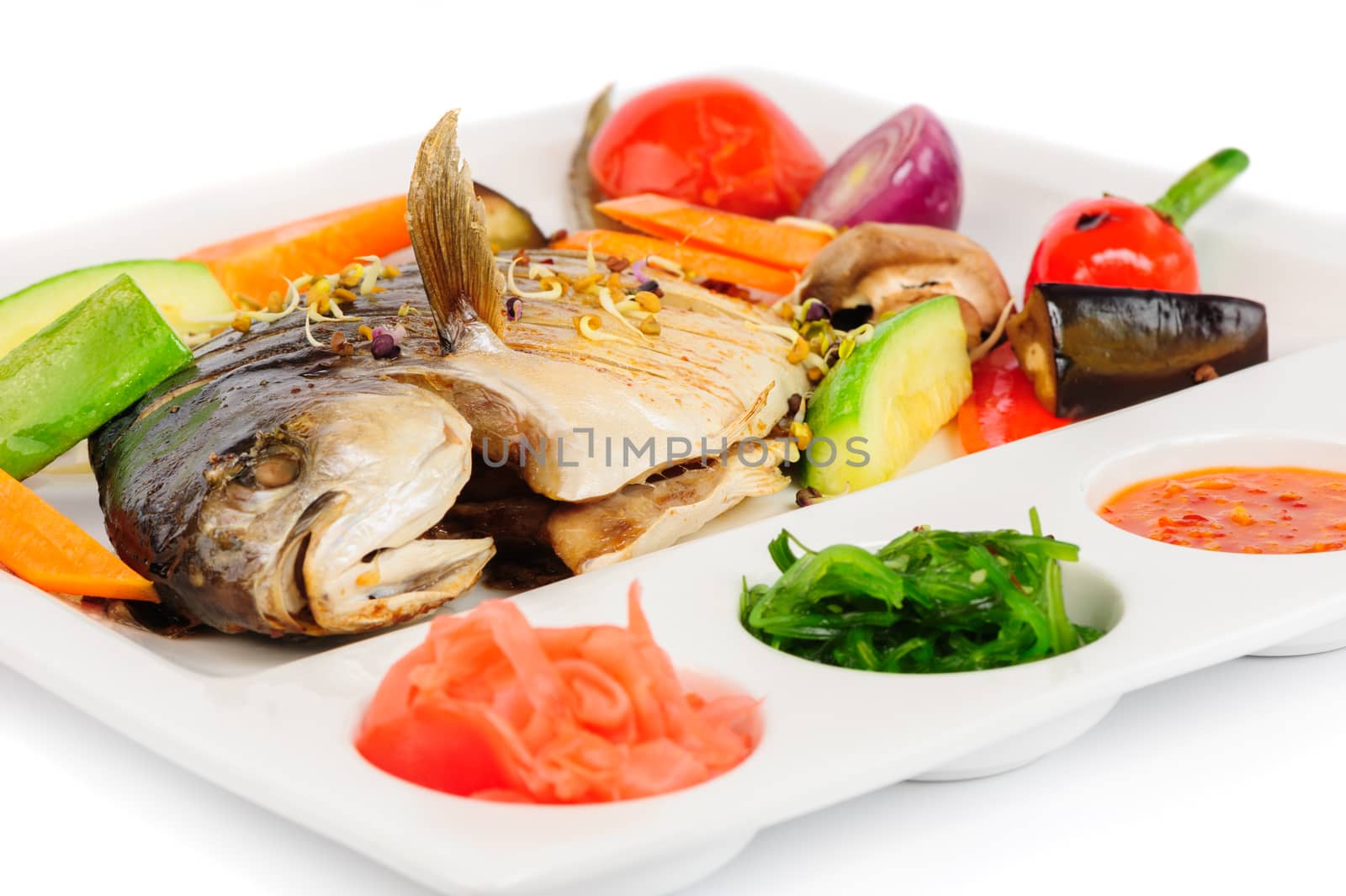 fried wish with grilled vegetables, pickled gin ger, chukka seaweed, hot sauce and lemon
