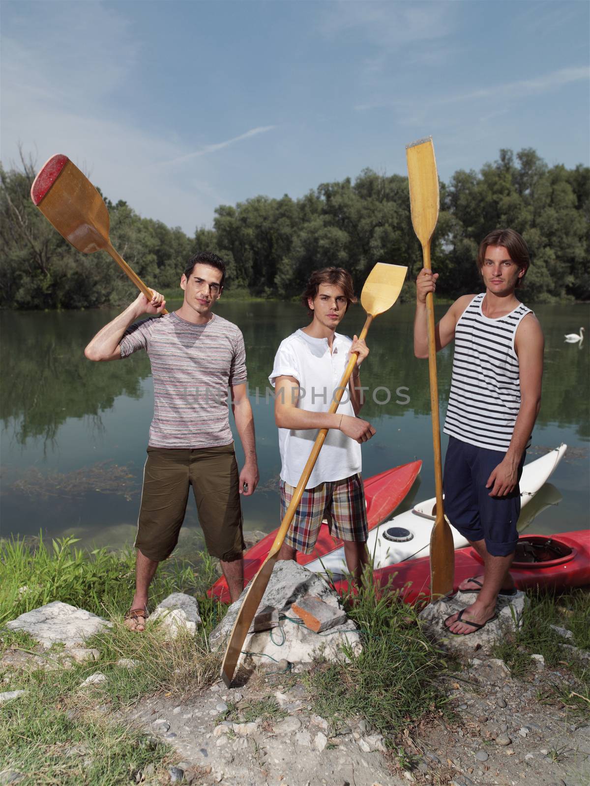 Young men with kayaks by toocan