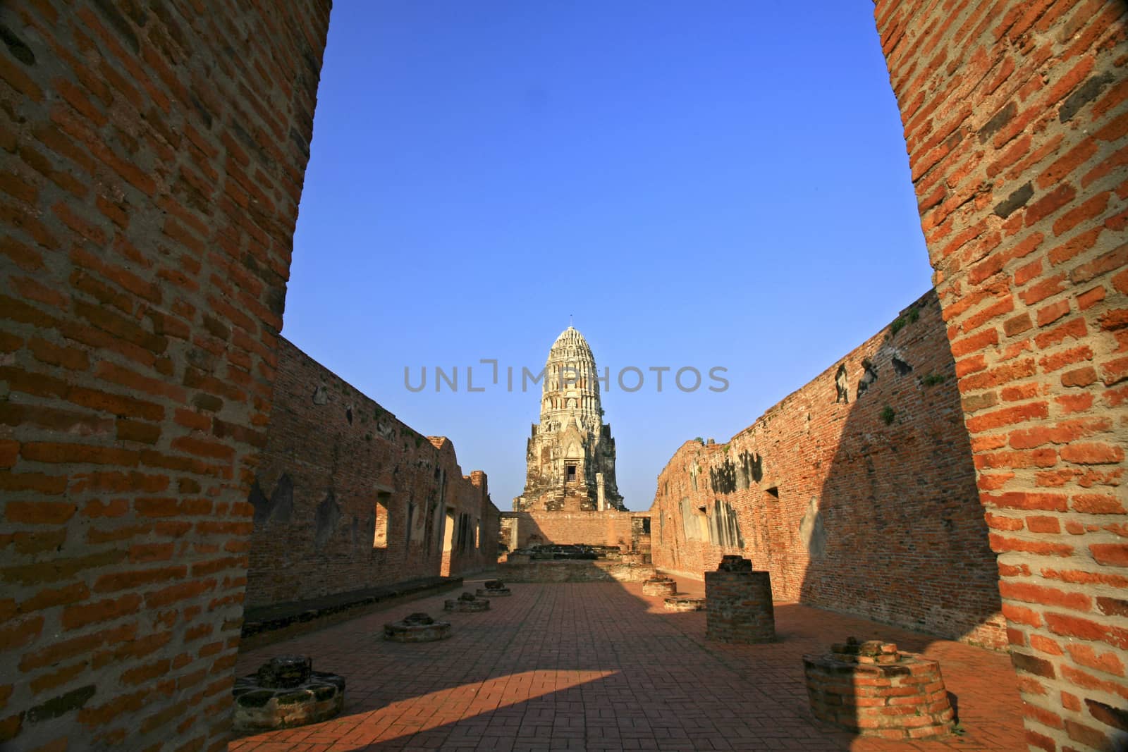 Wat Rajaburana gate and central tower in the background in Ayutt by think4photop