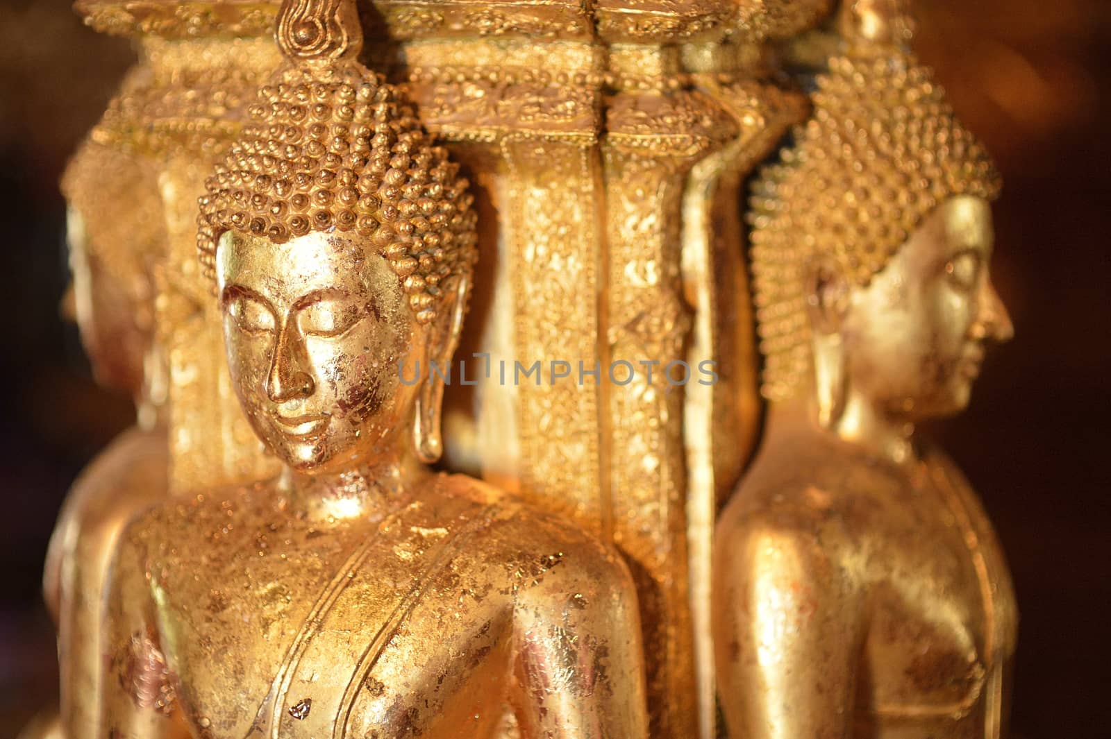 There are four small statues of Buddha in the temple Phumin Nan, by think4photop