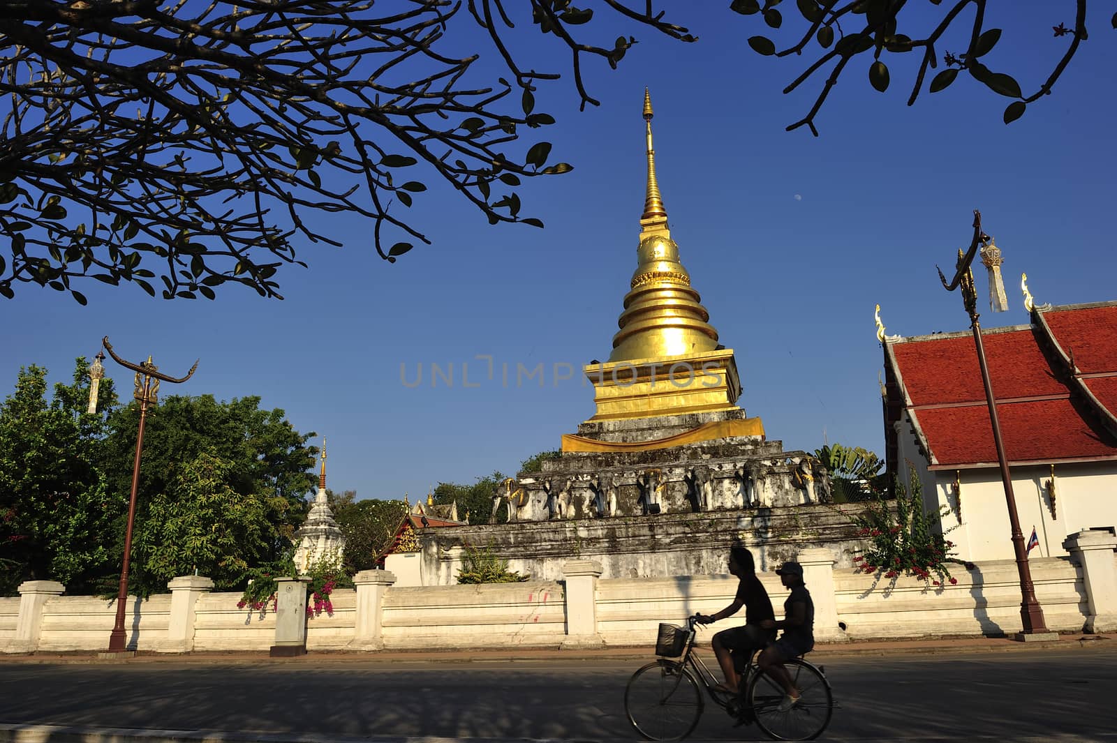 stupa of wat chang khum in nan Thailand by think4photop