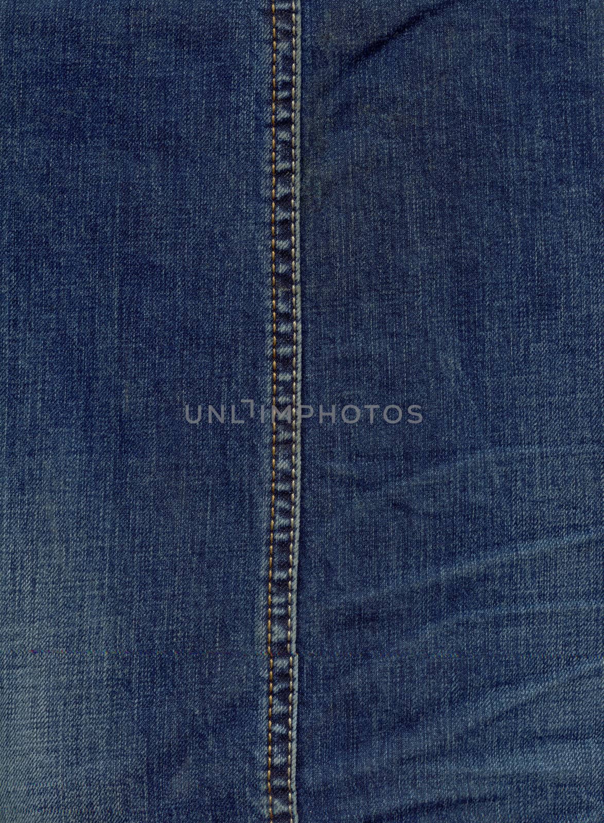 Texture of jeans cloth with a seam