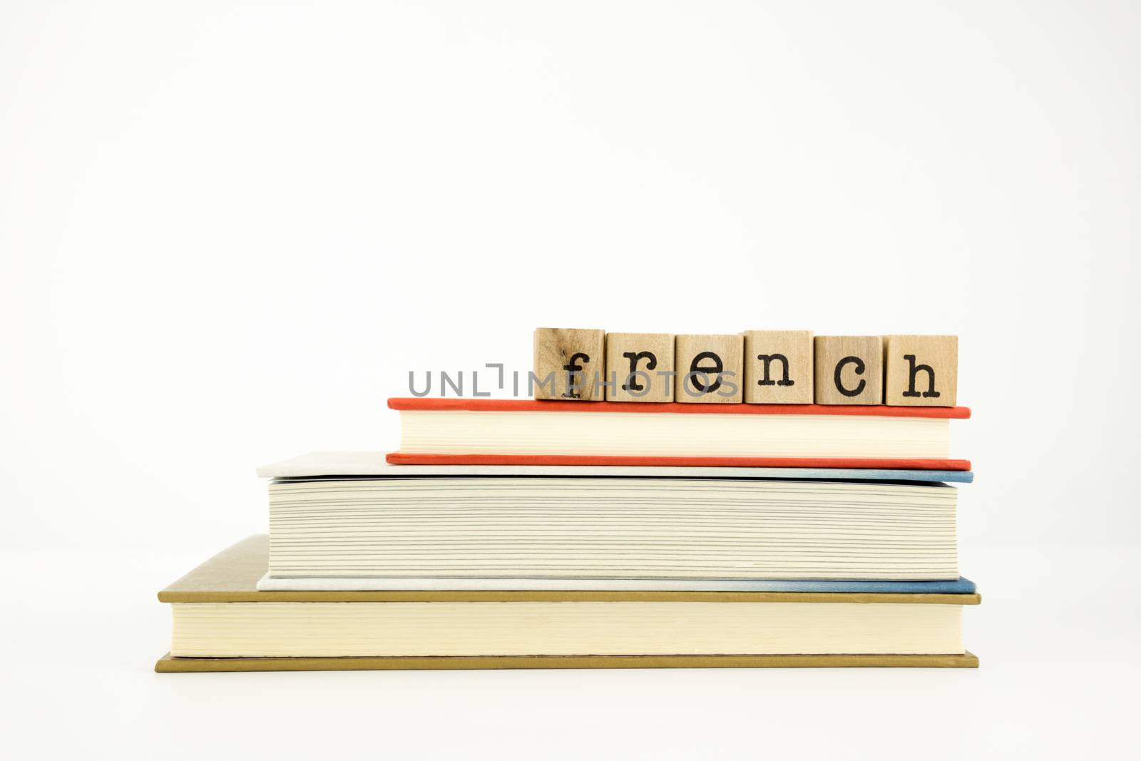 french language word on wood stamps and books by vinnstock