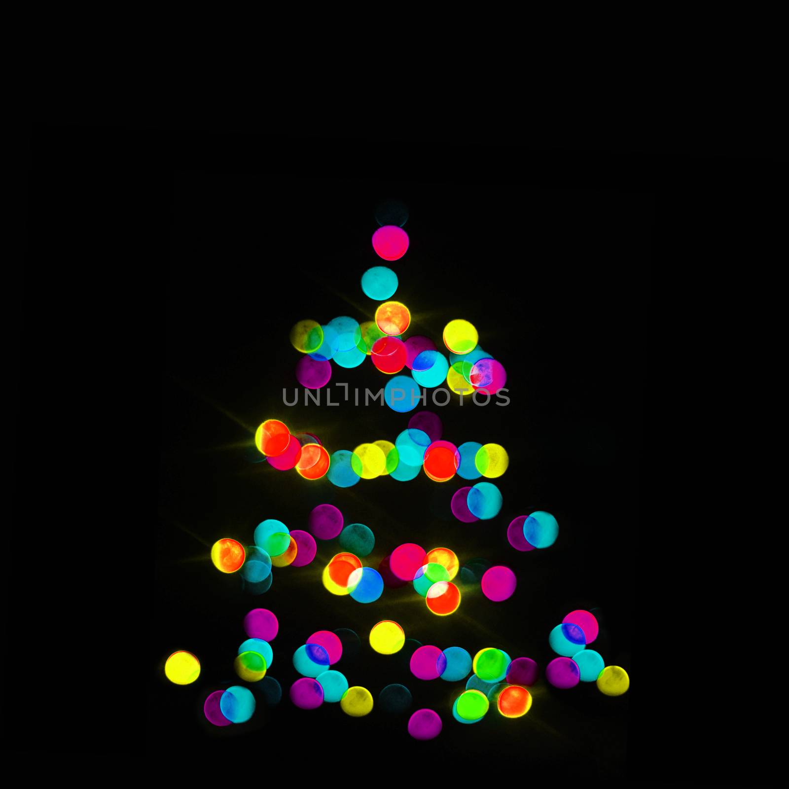 colorful strings of Christmas tree lights on the black background