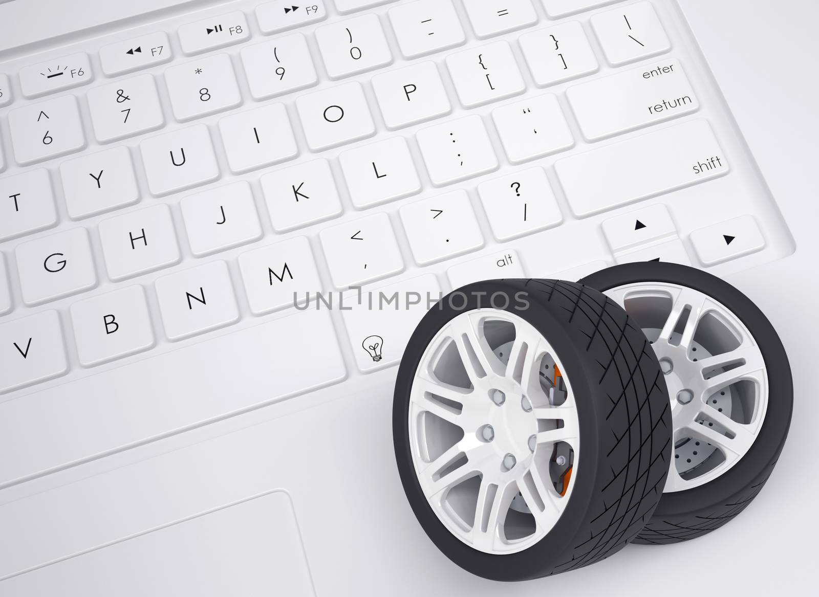 Car wheels on the keyboard. View from above