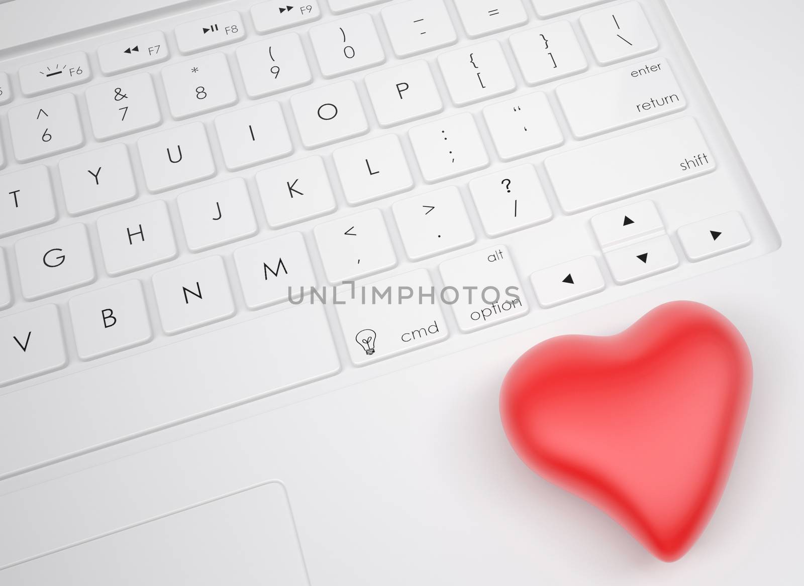 Red heart on the keyboard. View from above