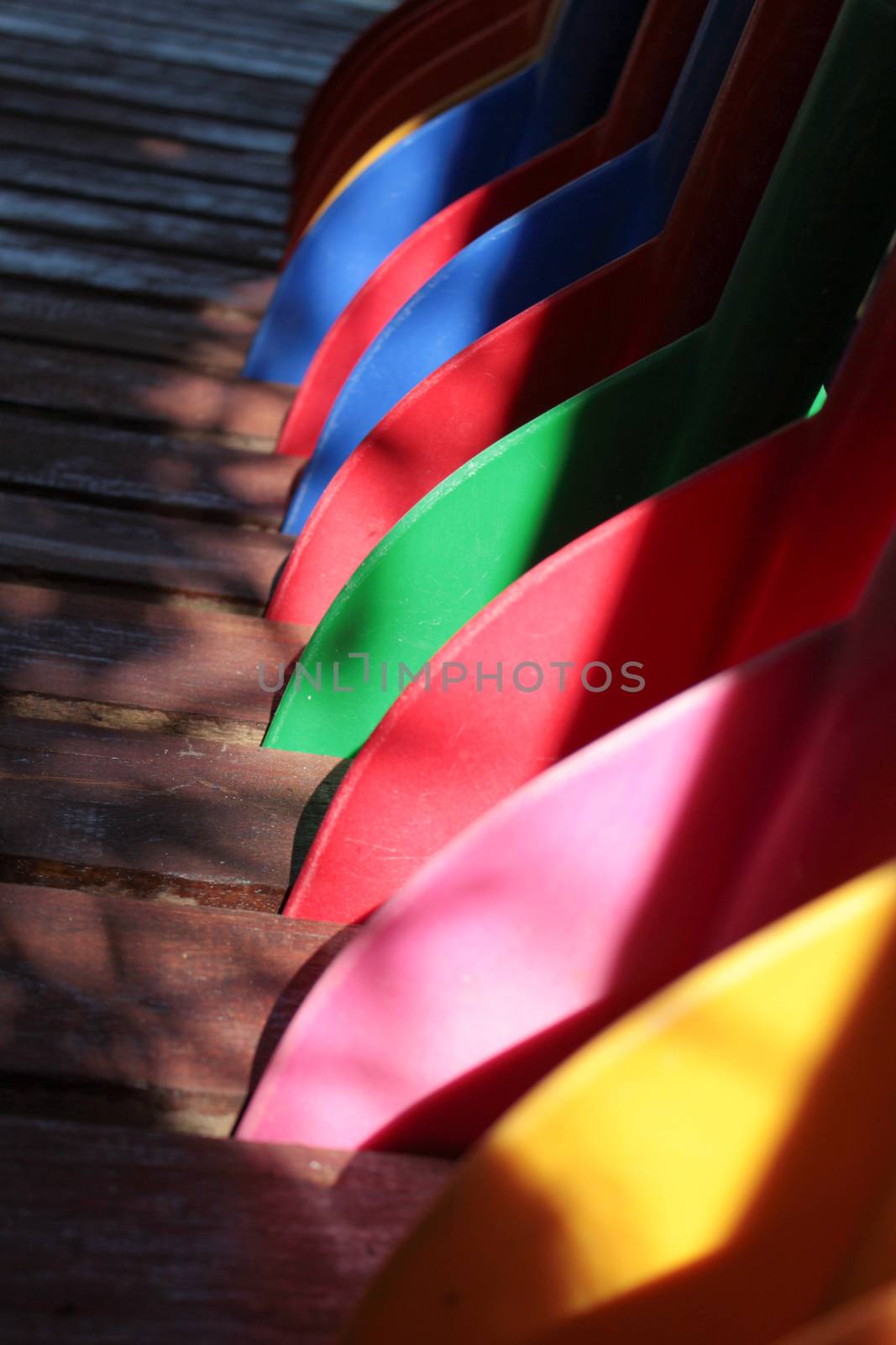 colorful oars on wood bridge