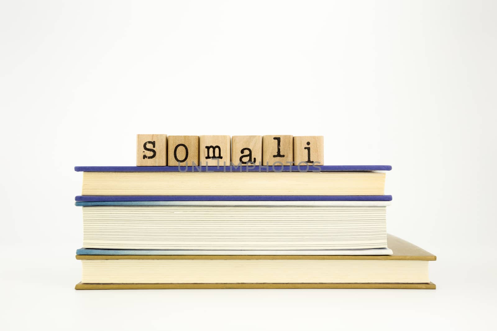 somali word on wood stamps stack on books, academic and language concept