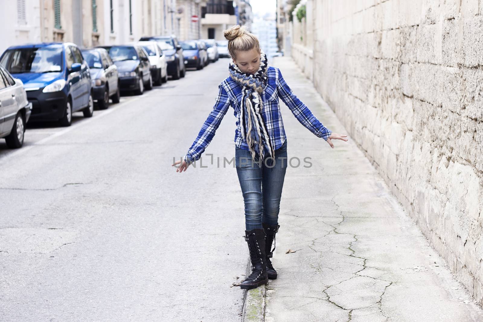 Girl walking on a city street by annems
