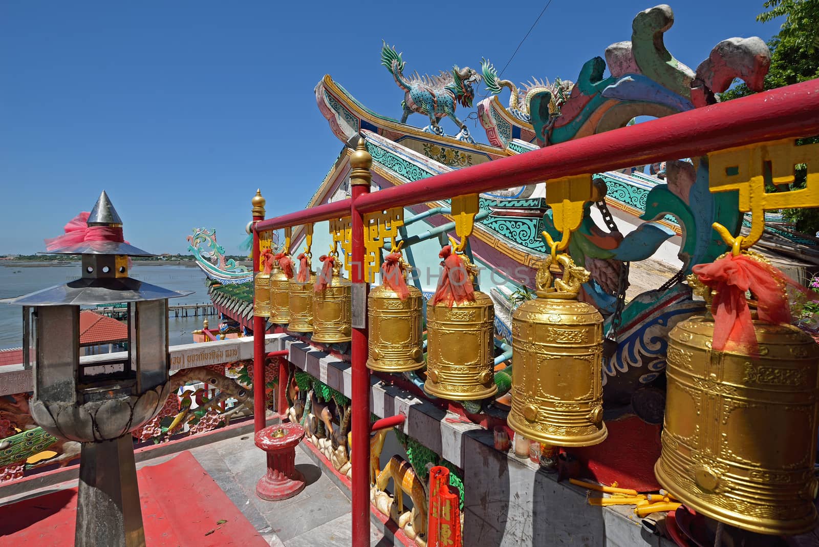 bells in a chinese temple in Choburi province, Thailand. by think4photop