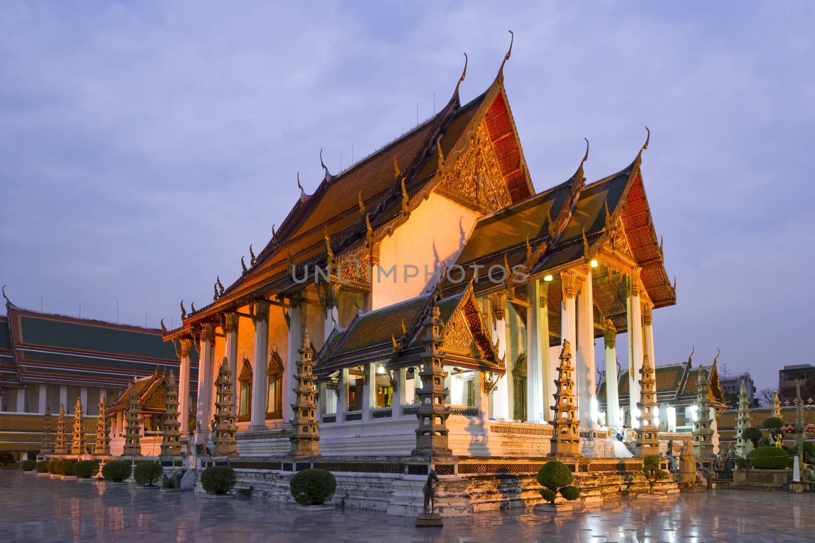 Temple at twilight, Suthat Temple, Bangkok, Thailand by think4photop
