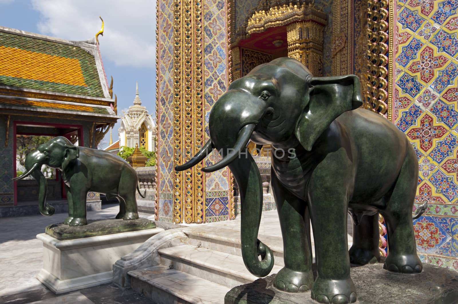 Marble statues of elephants at Thai temple by think4photop