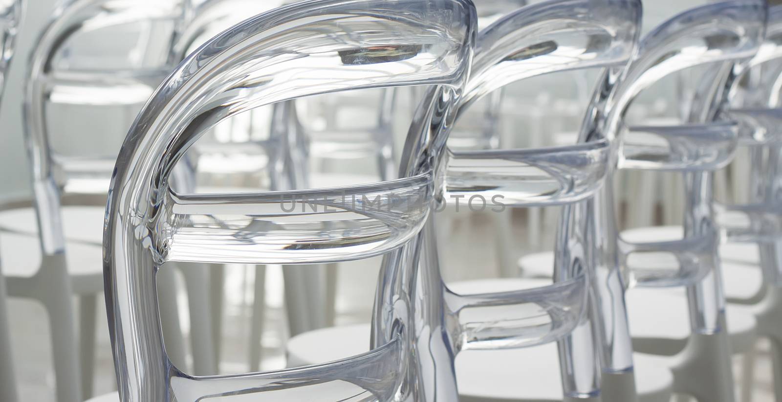 Close up of elegant contemporary designed plastic chairs, shot from the back
