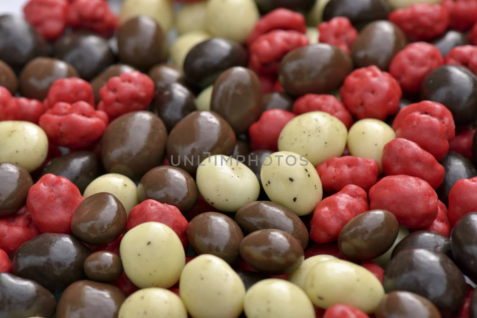 Close-up of mixed chocolate-covered coffee beans to use as background