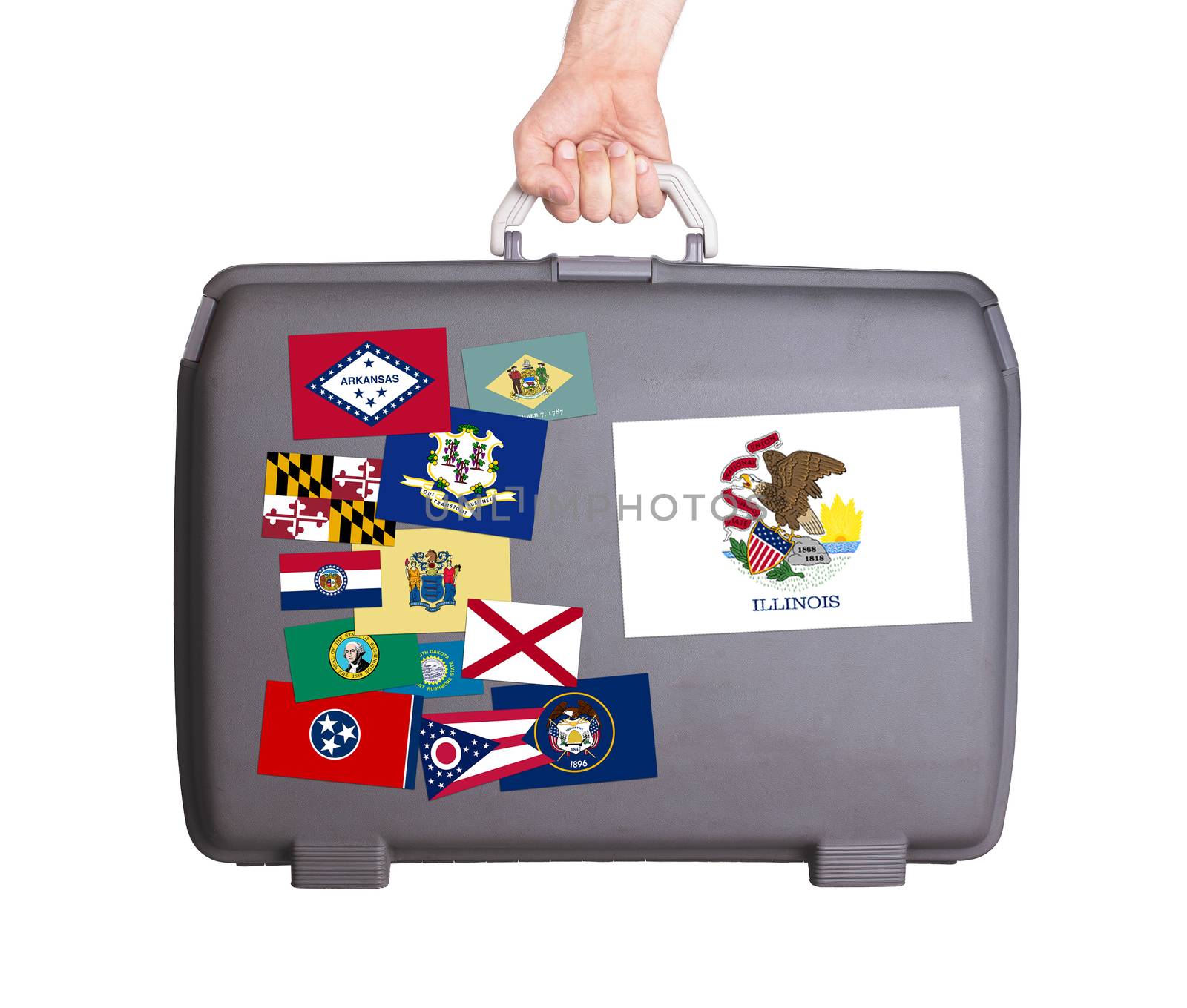 Used plastic suitcase with stains and scratches, stickers of US States, Illinois
