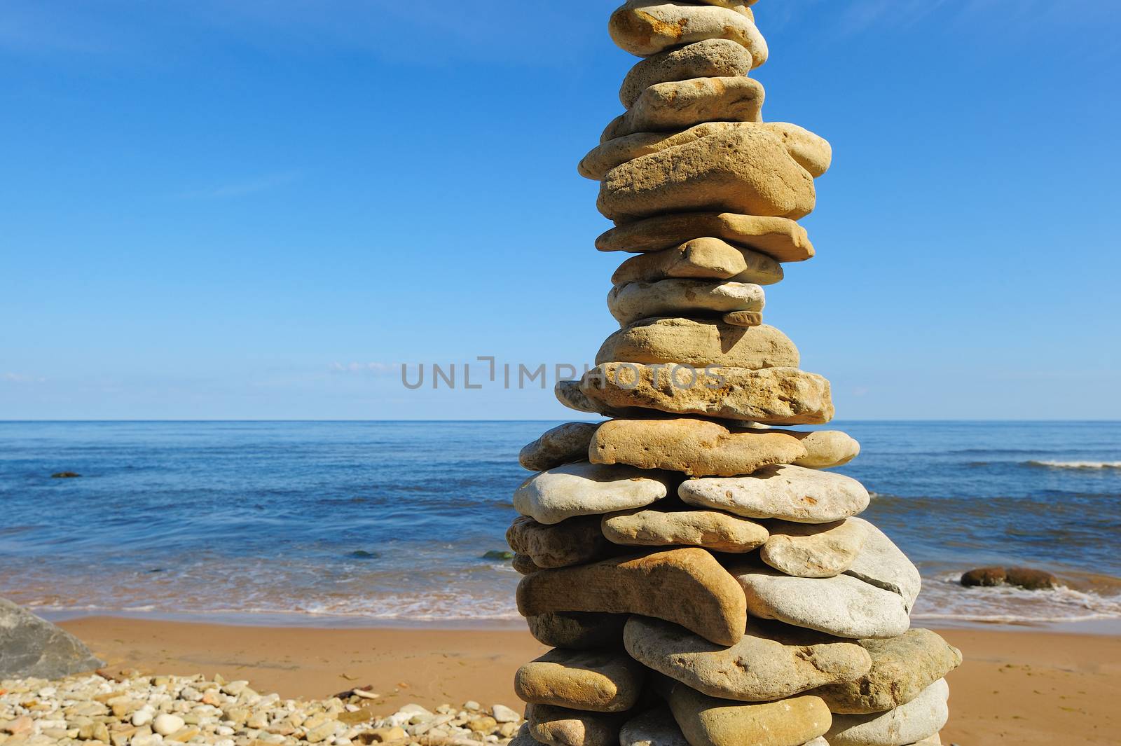 Pyramidal stack of pebbles on the coast