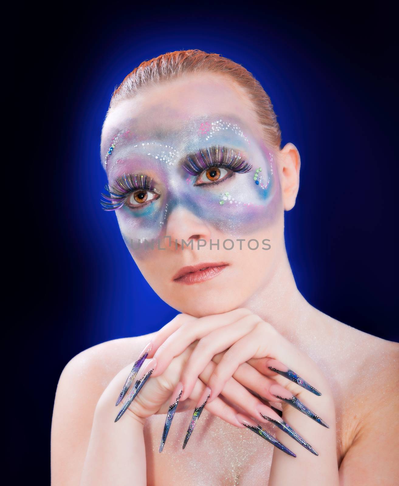 Photo of a girl with long fingernails and trendy makeup