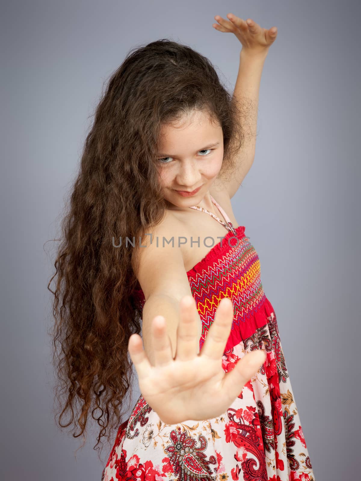 An image of a beautiful young girl dancing