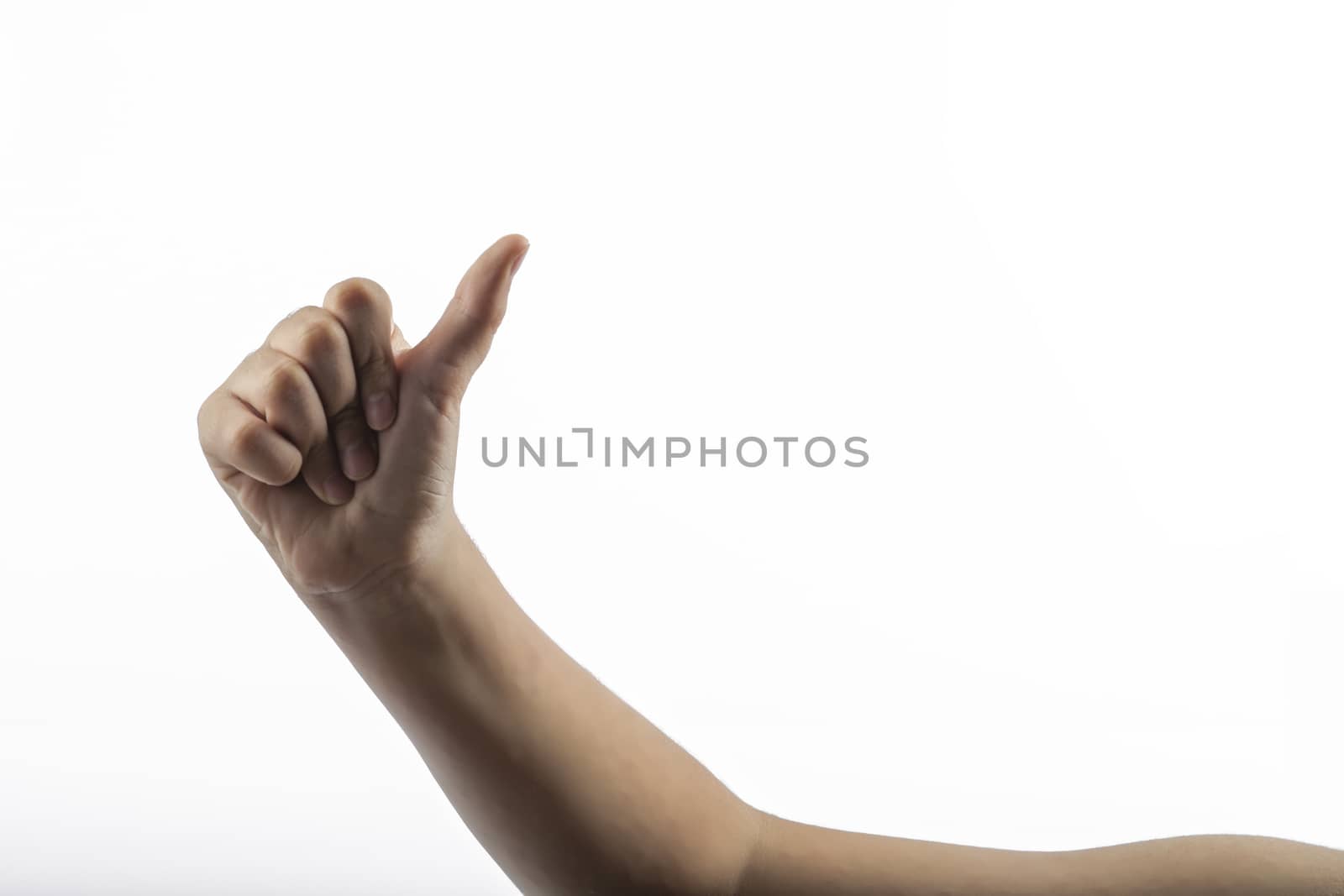 Young hands makes a gesture: hitchhiking sign 