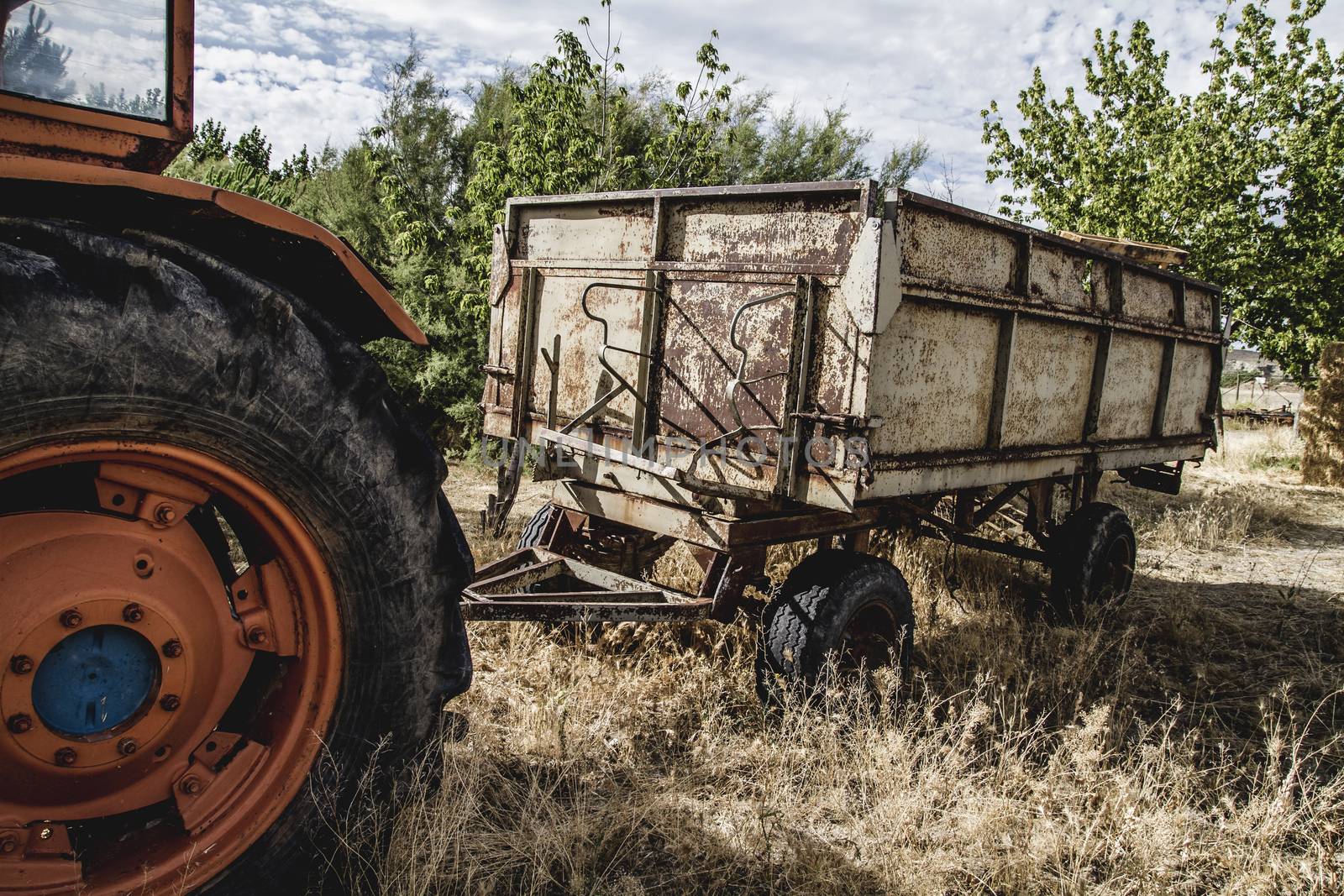 rural, old agricultural tractor abandoned in a farm field