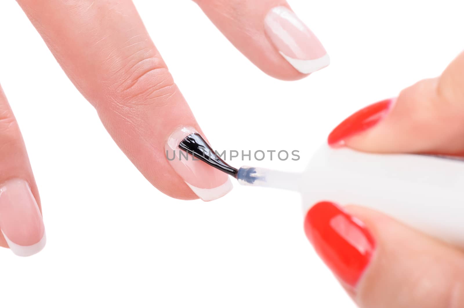 manicure applying, brushing fingernails with clear enamel