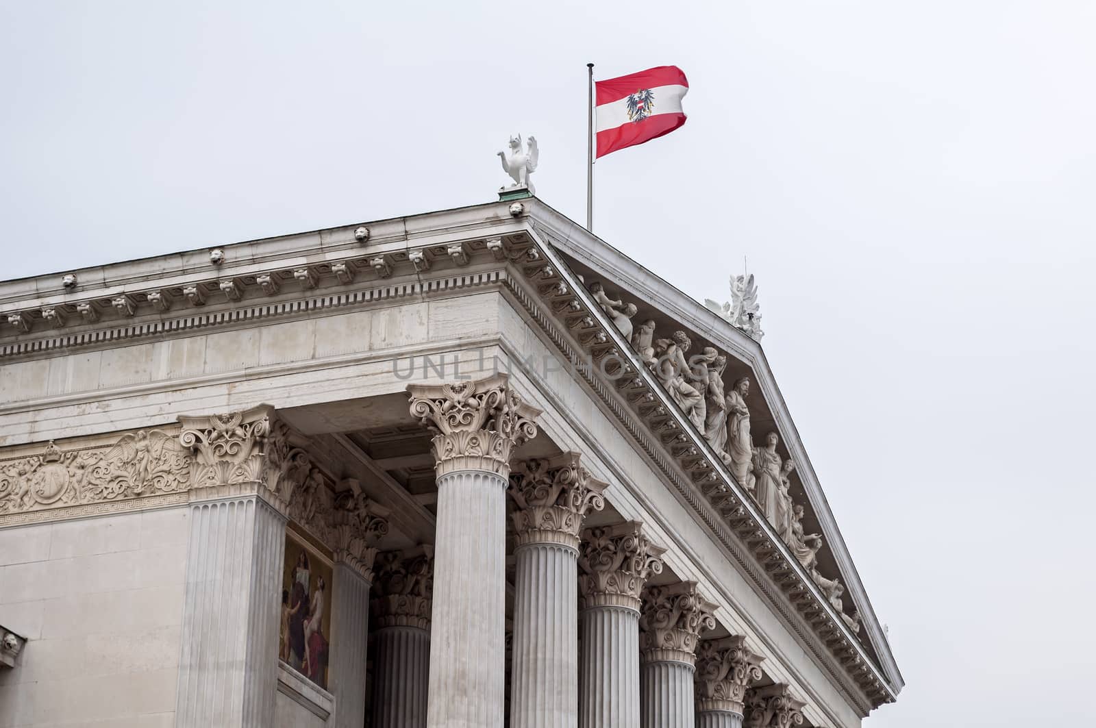 Austrian Parliament building and flag in Vienna.