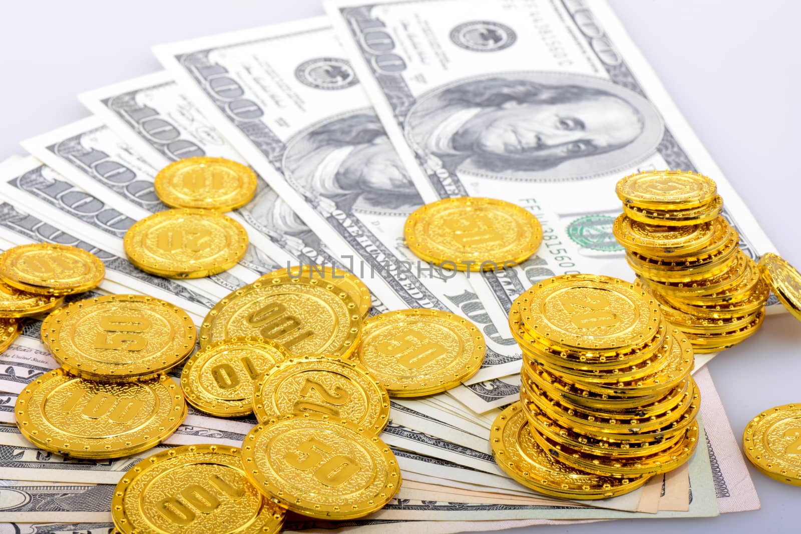 gold coins and dollar banknotes