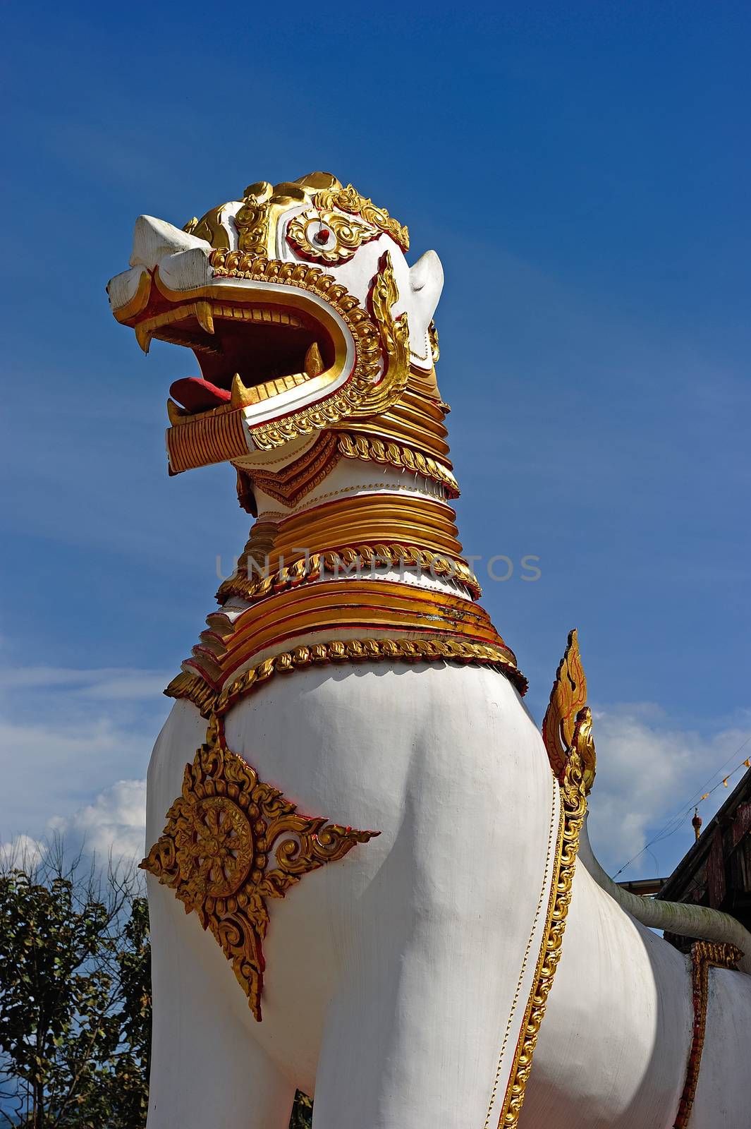 Singha, Lion Statue in front of mon temple in Sangkraburi, Kanch by think4photop