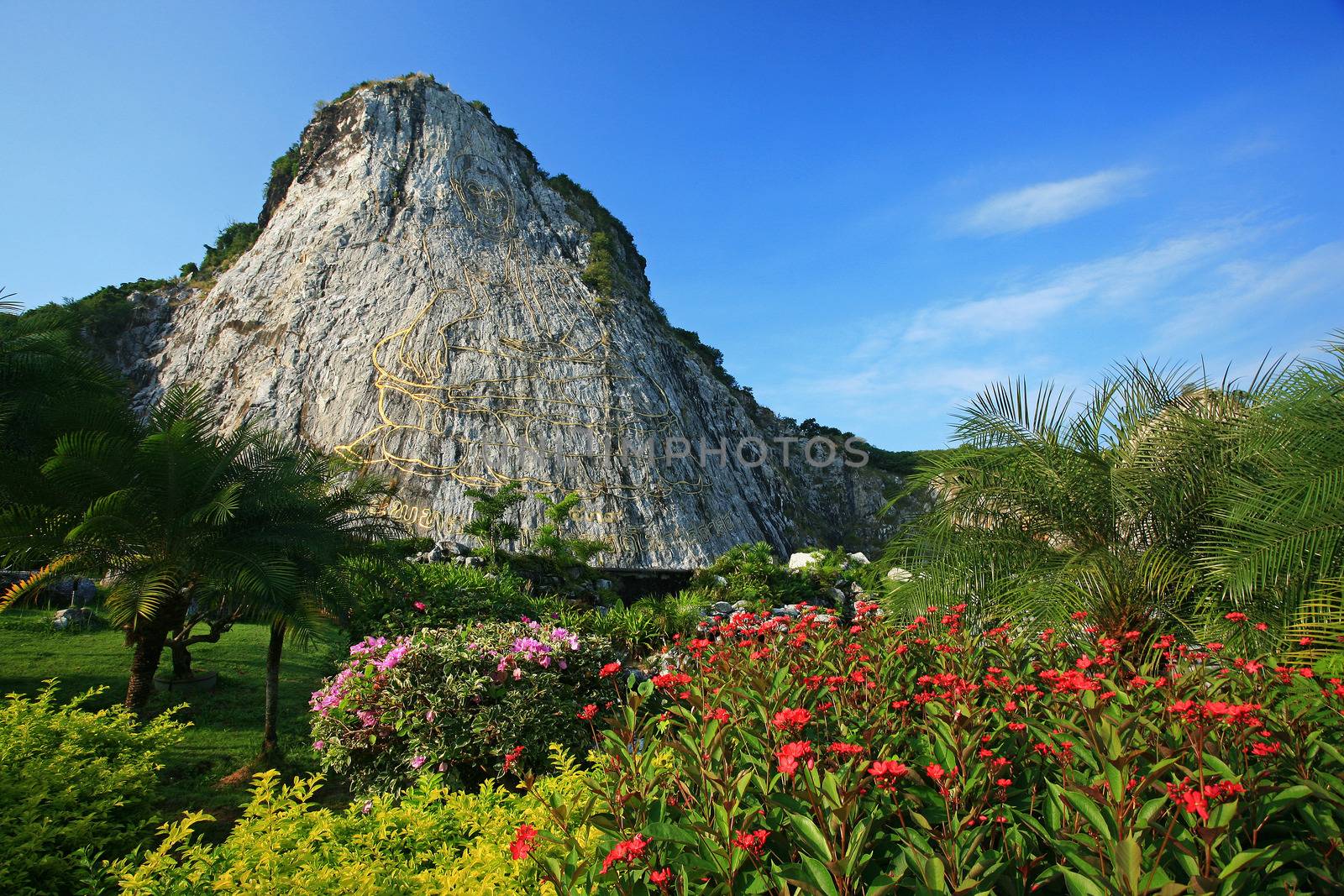 Carved buddha image on the cliff at Khao Chee Jan, Pattaya, Thailand