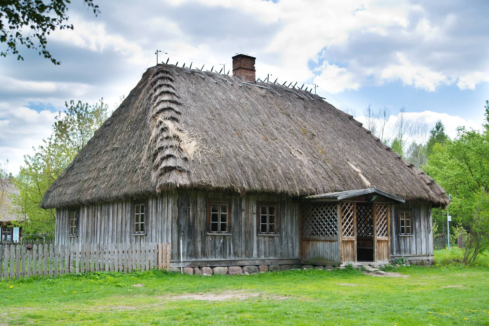 Old rural house with thatched roof near Bialystok, Poland