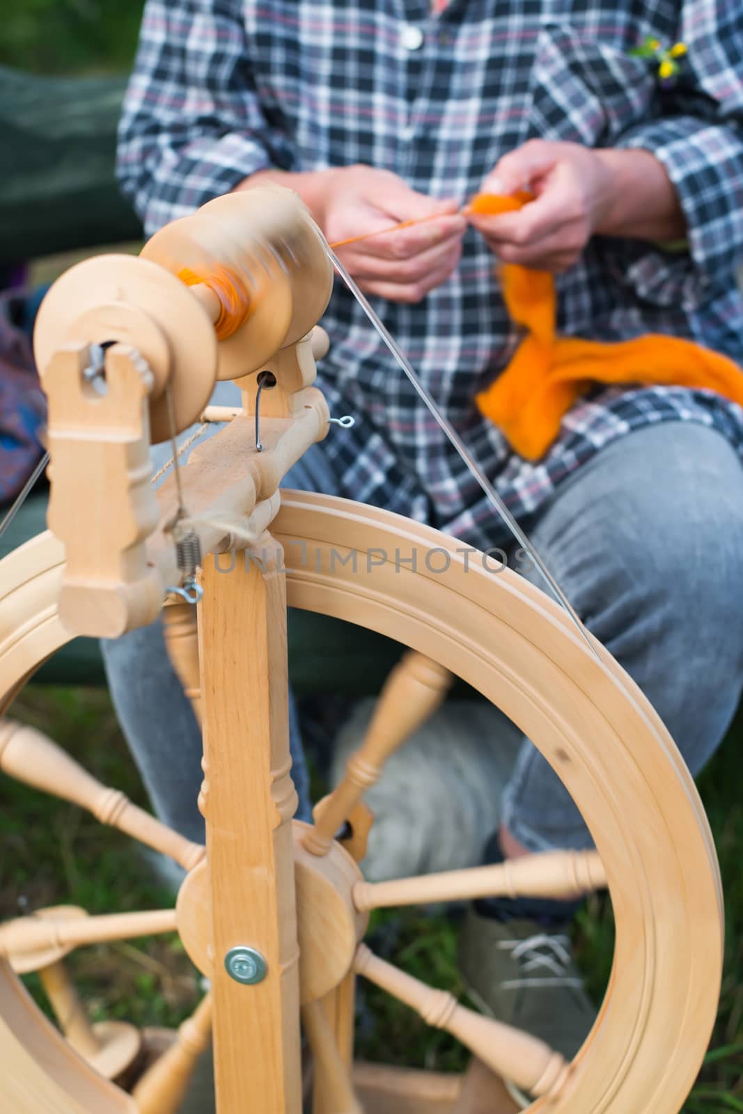 woman working with spinning wheel by furzyk73