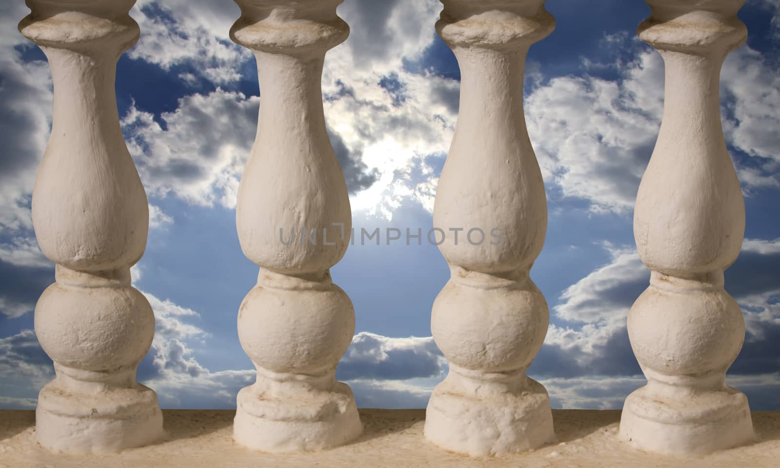 Baluster or little columns and sky behind it by fotoecho
