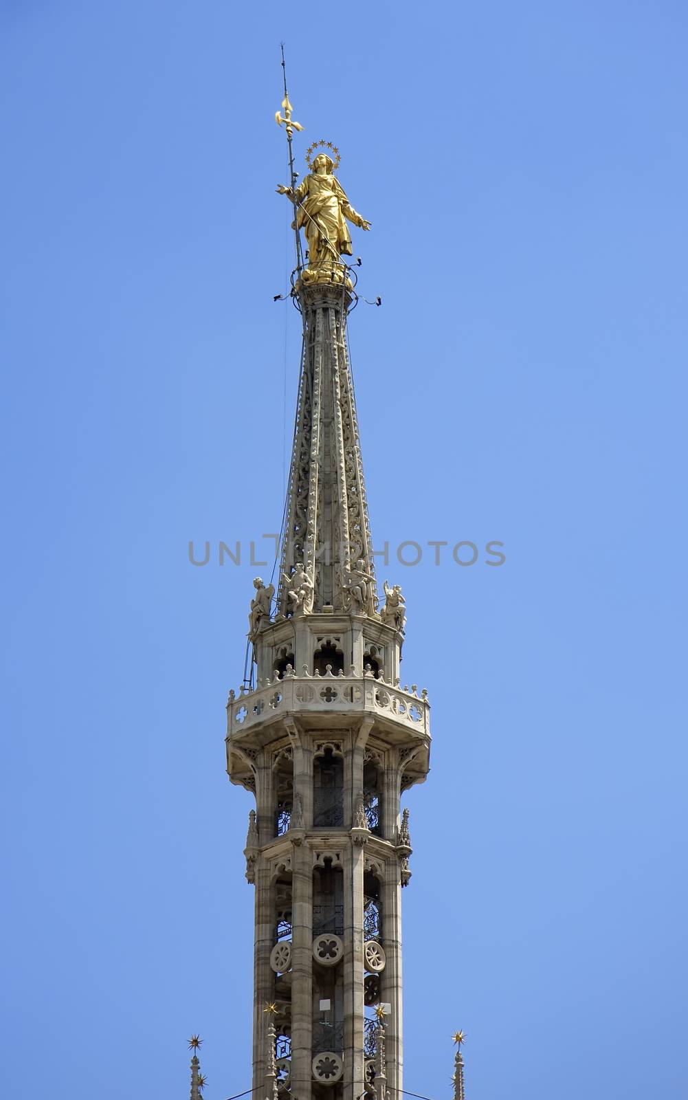 Little Madonna, golden Mary - protector of Milan city at the top of Duomo, Italy