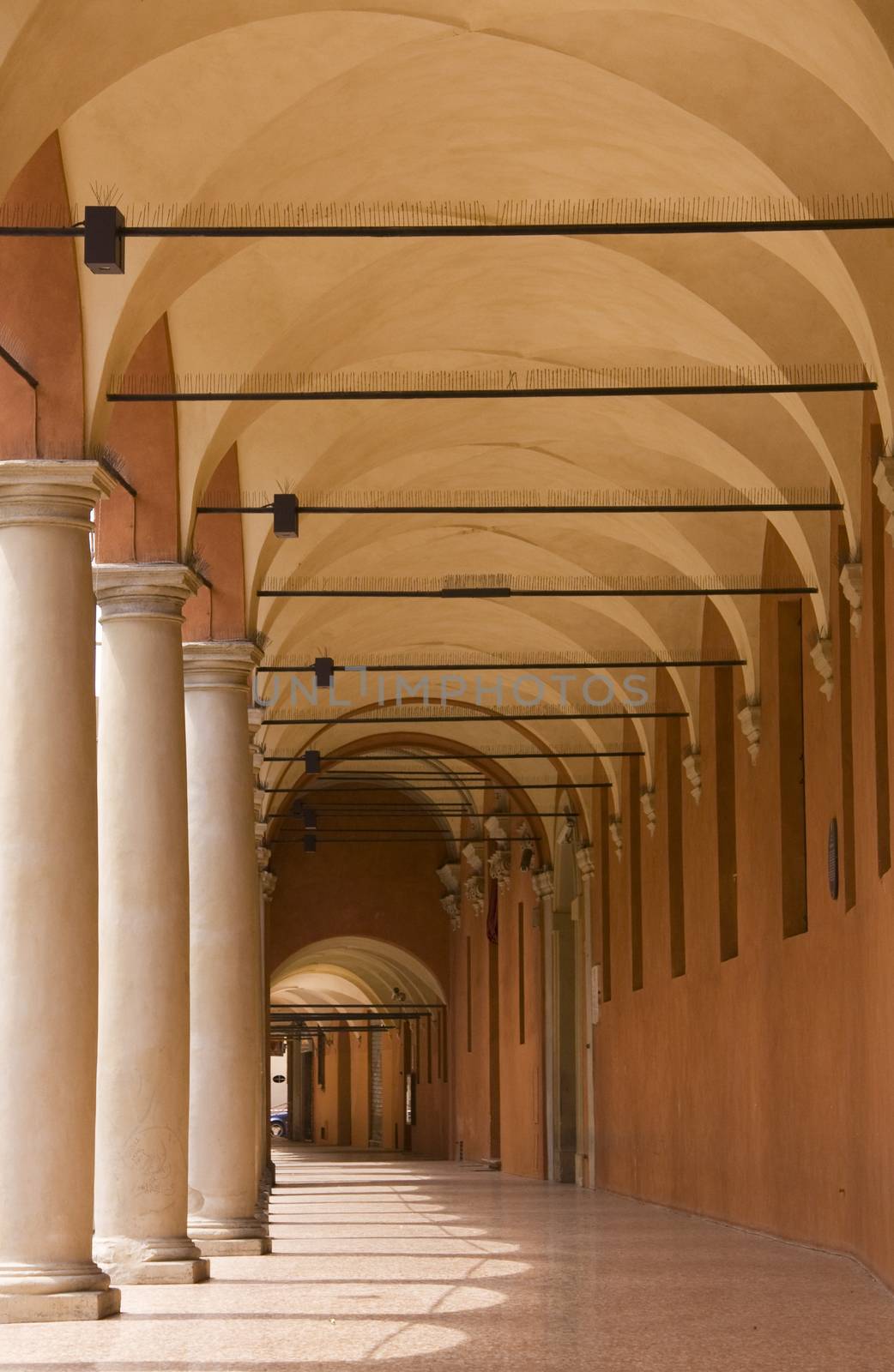 Medieval portico with columns, Bologna, Italy.
