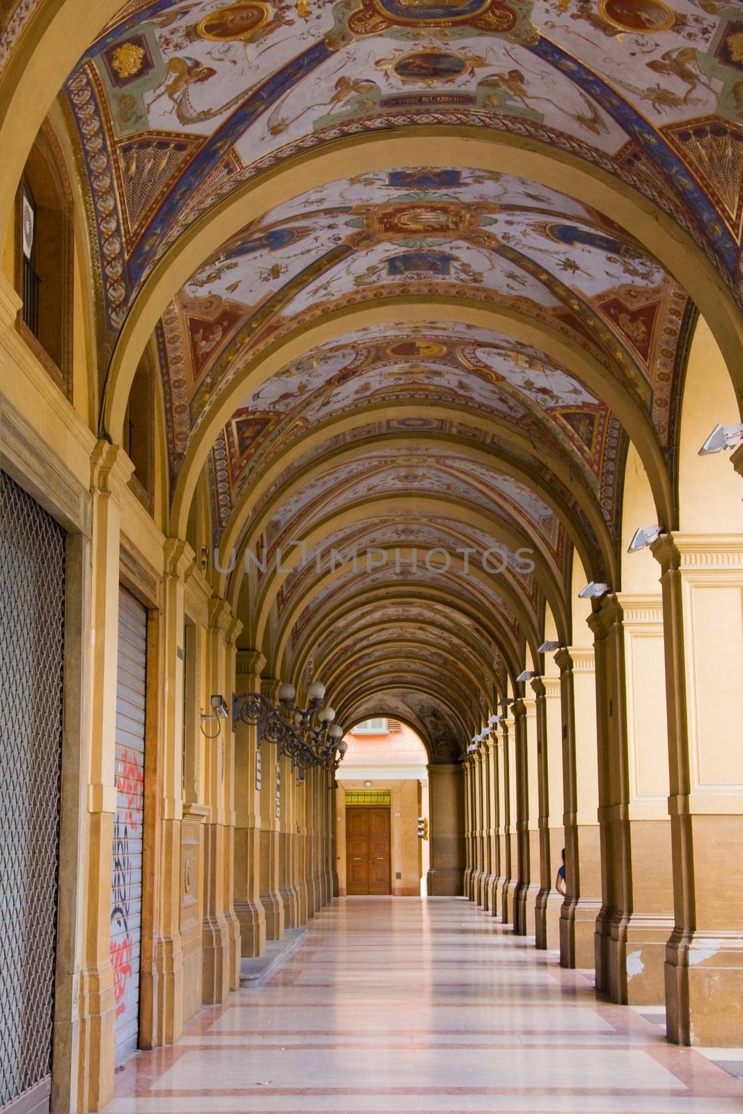 Decorated old portico with columns in Bologna, Italy