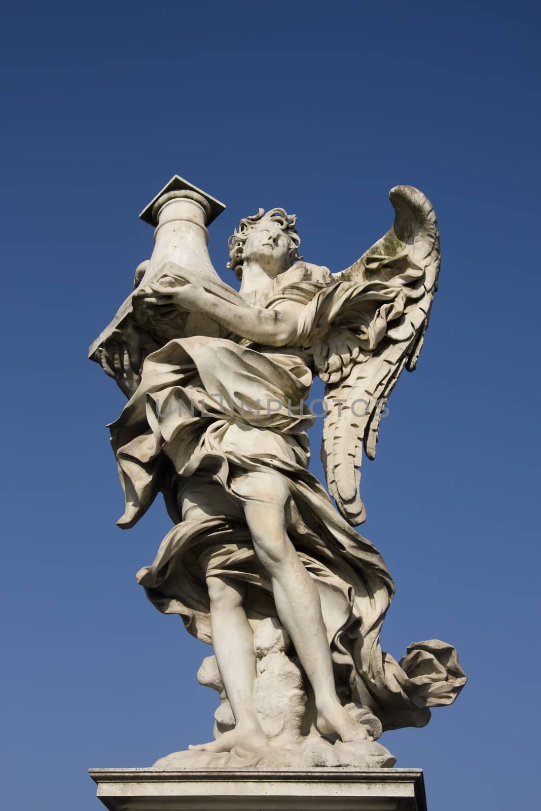 Angel statue on the St. Angelo Bridge in Rome by fotoecho