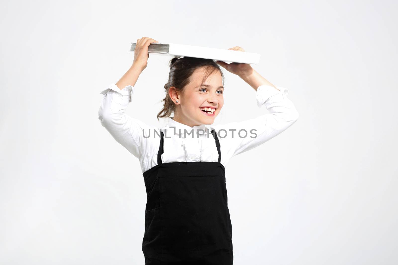 Balance, child with books on her head by robert_przybysz