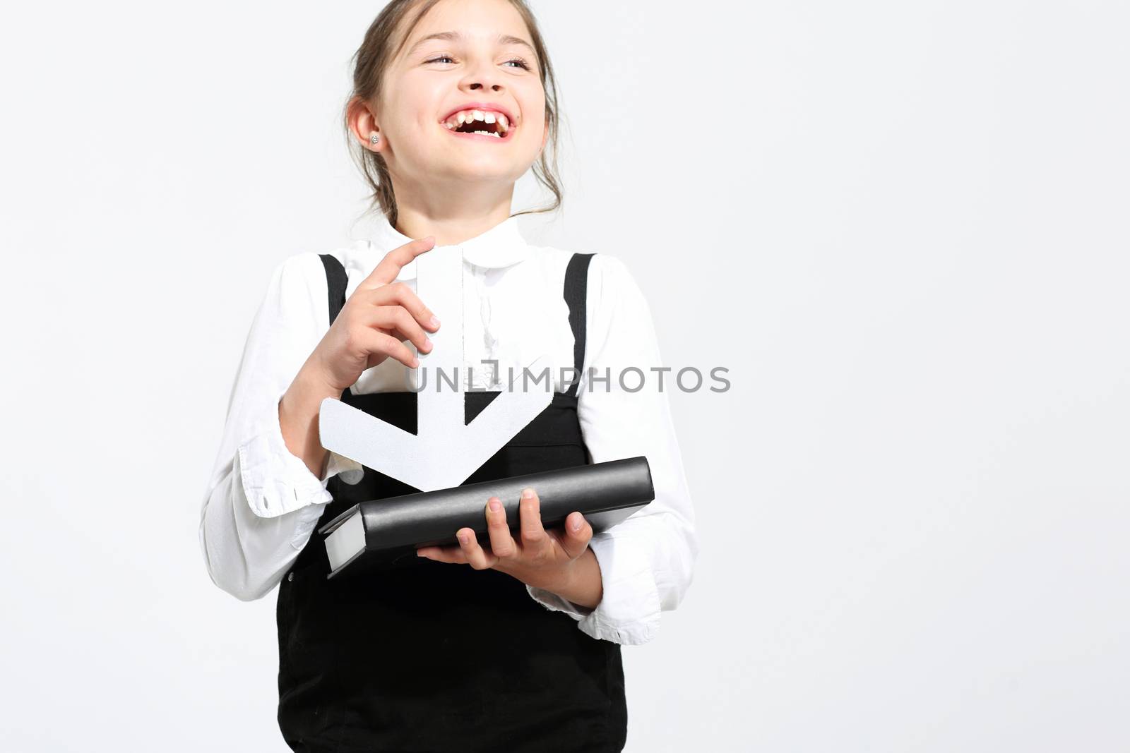 Girl in school uniform on a white background indicates the manual silver arrow