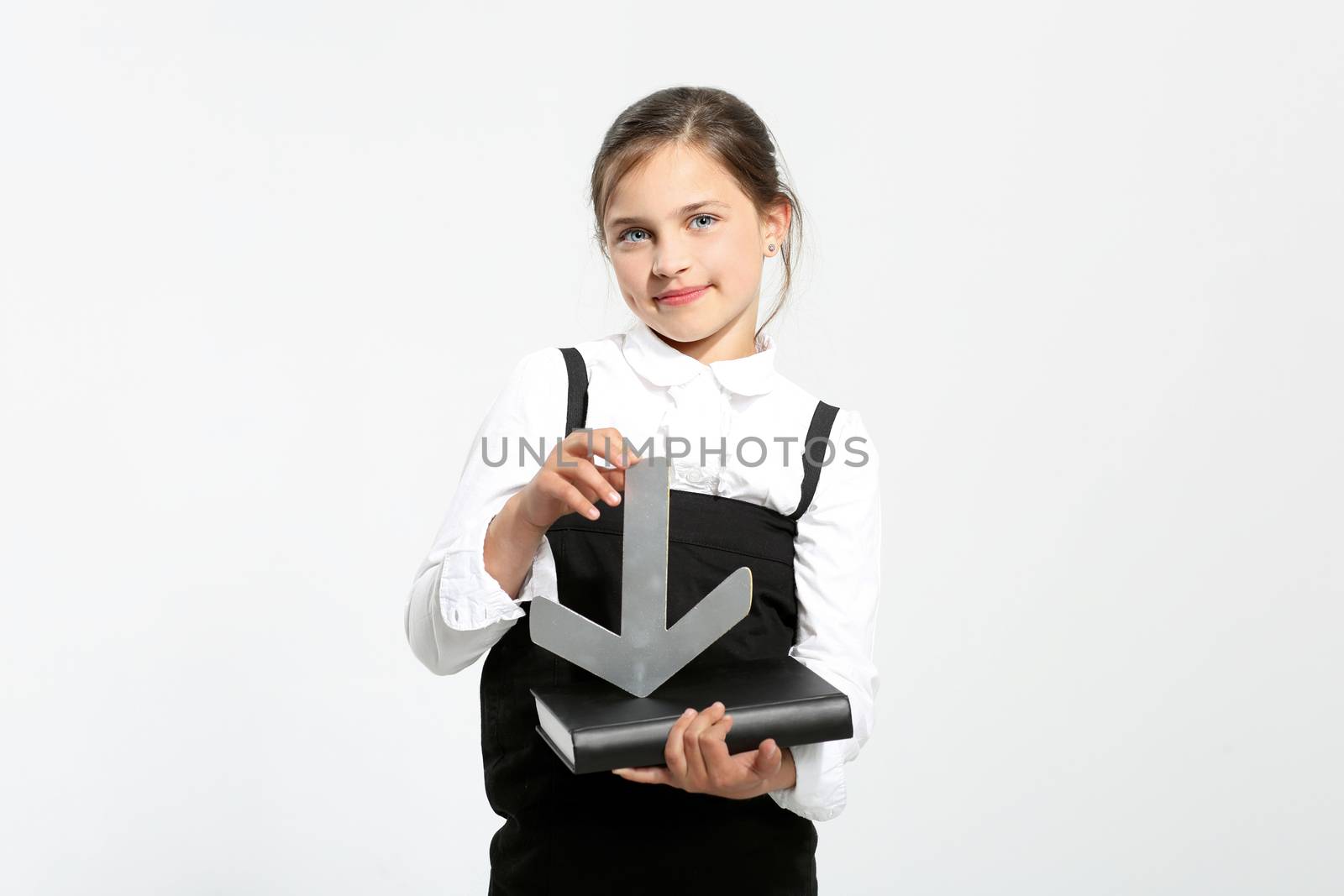 Girl in school uniform on a white background indicates the manual silver arrow