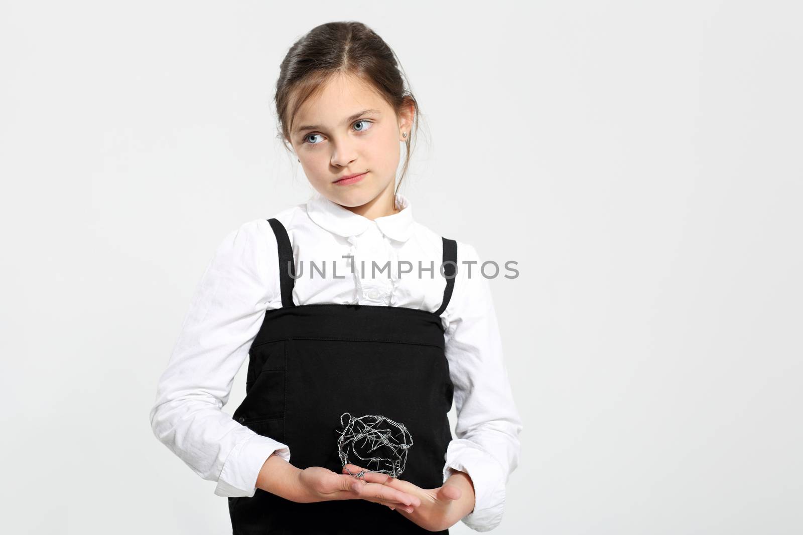Cute little girl standing by a black school board by robert_przybysz
