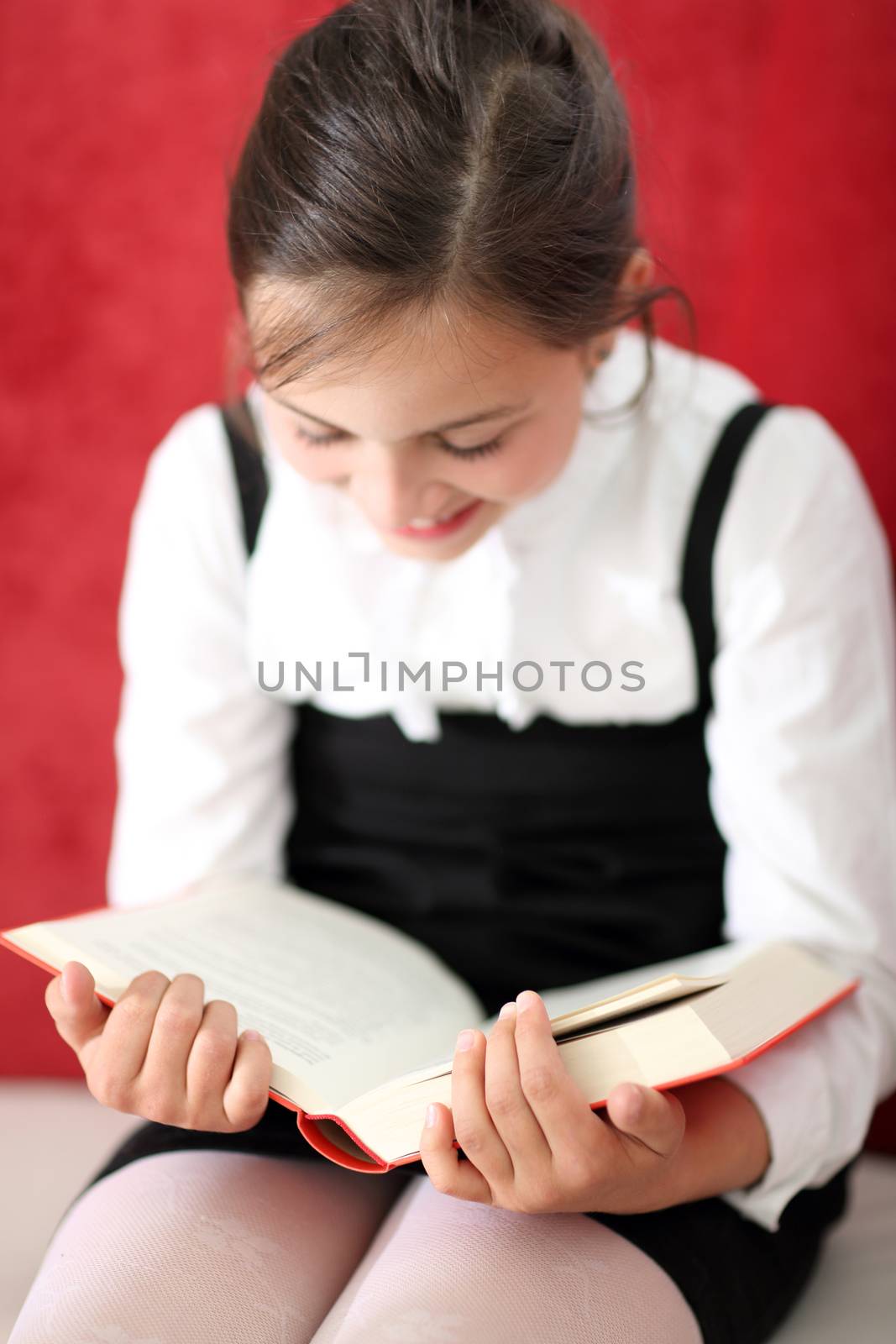 Girl reading a book by robert_przybysz